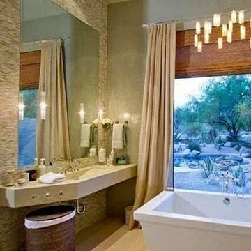 A bathroom with candles and a tub in it