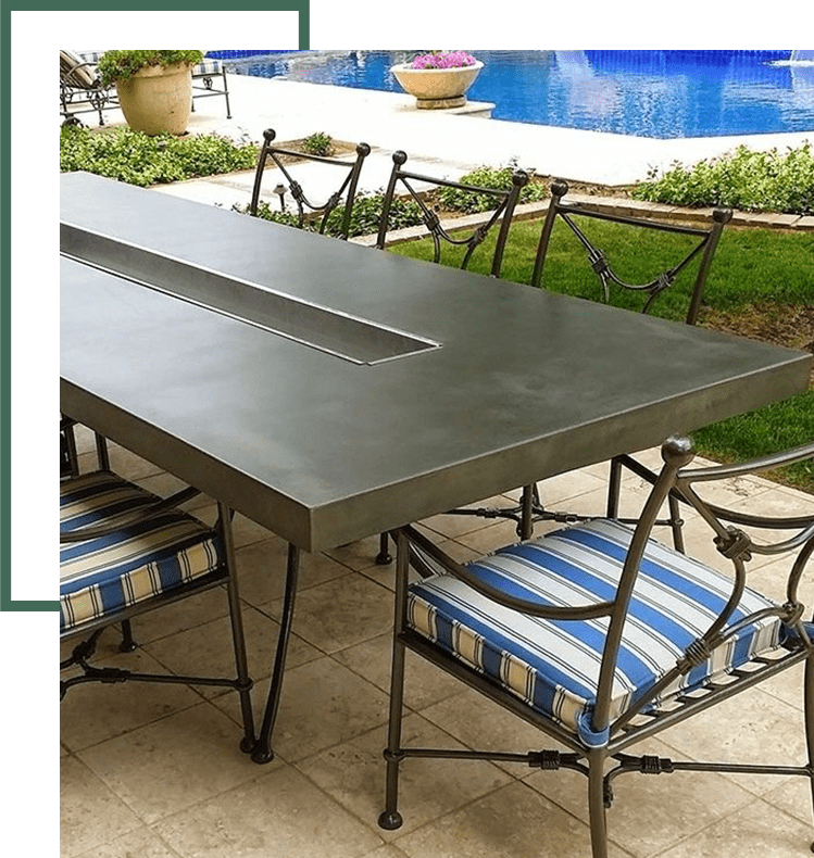 A table and chairs set up in the middle of an outdoor patio.